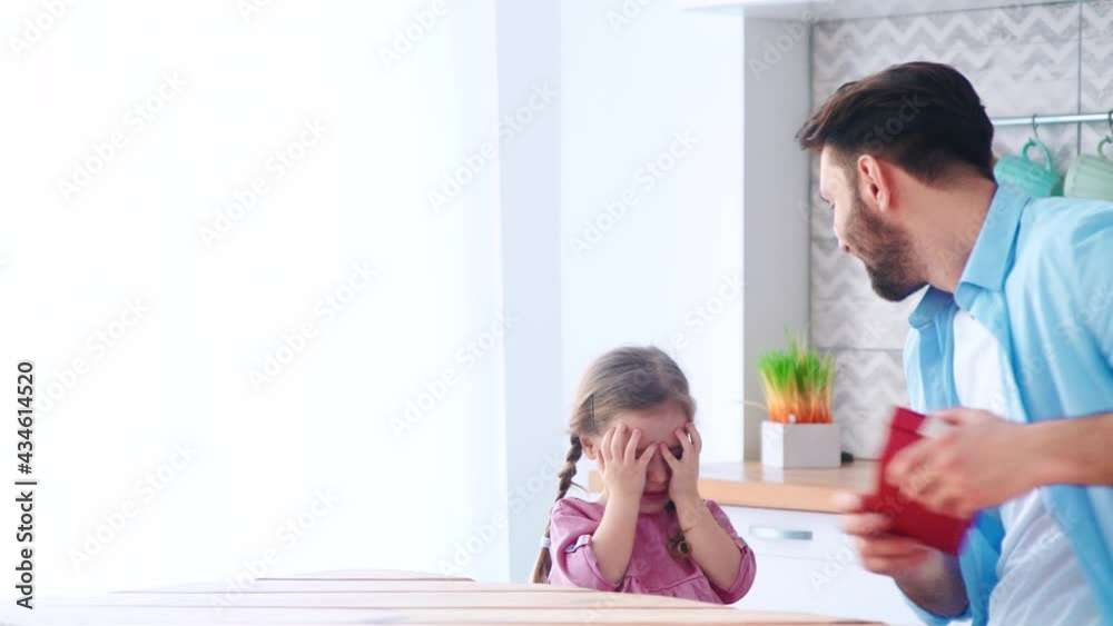 Father giving a birthday present to his daughter. Happy birthday Father giving a birthday present to his daughter. Happy birthday