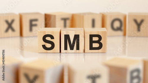 smb - server message block - letters on wooden cubes on white background photo