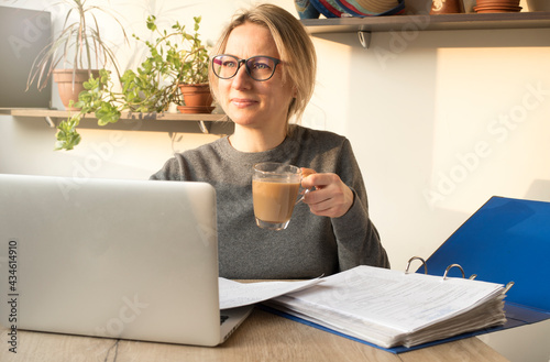 A  blogger, manager, employee is happy to do his job. Freelancer working from home concept photo