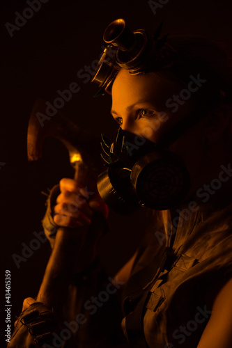 brutal woman in gas mask on neon light