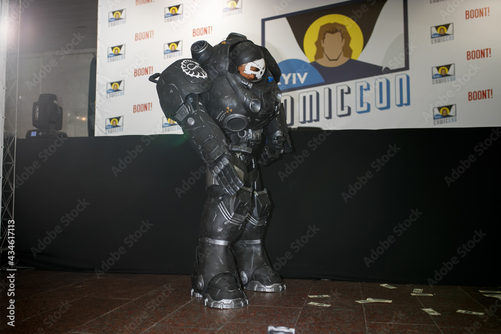 Naklejka premium Kiev, Ukraine - June 1, 2019: Kiev Comic Con, an annual fandom festival in Ukraine. Girl in Miss Marvel costume. Cosplayers dressed as their favorite superheroes. Marvel Cosplay, Avengers, DC