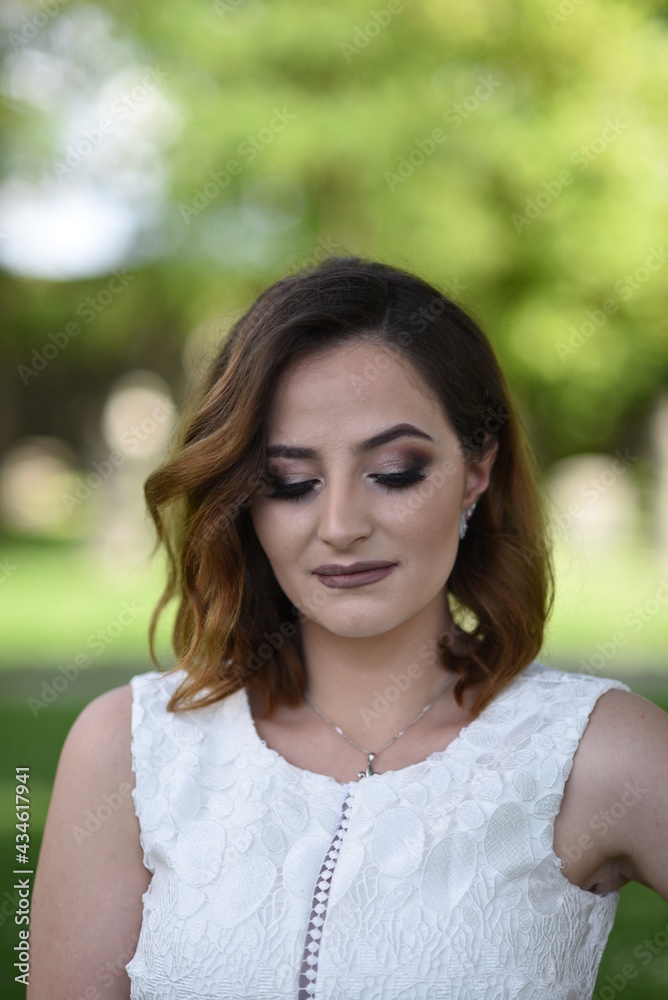Beautiful young girl posing in the old town