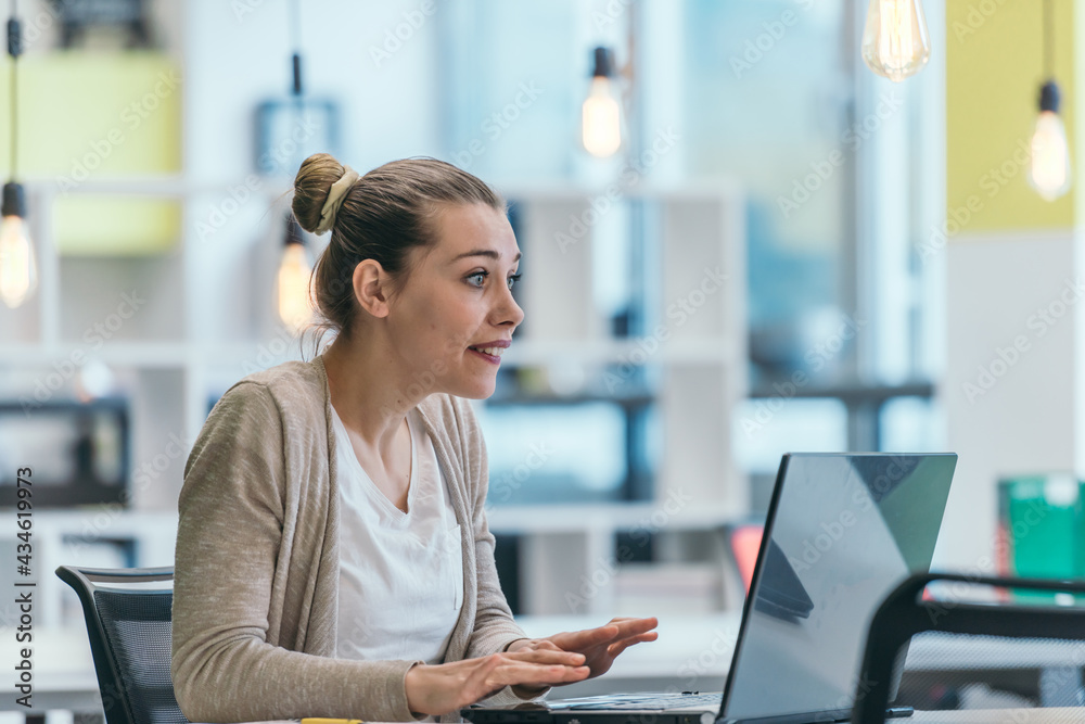 Blonde manager working behind her desk in a modern office. Blonde manager working behind her desk in a modern office.