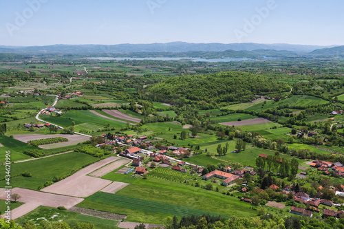 View over the villages and farm fields in the valley to the Gruža lake in Serbia photo