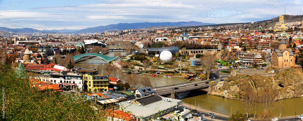 Panorama of historic center of Tbilisi city on banks of Mtkvari River on sunny spring day, Georgia