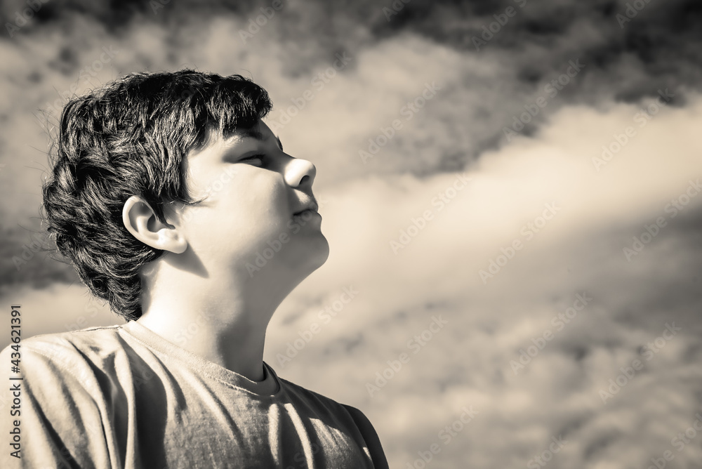 portrait of a boy greeting the sun portrait of a boy greeting the sun