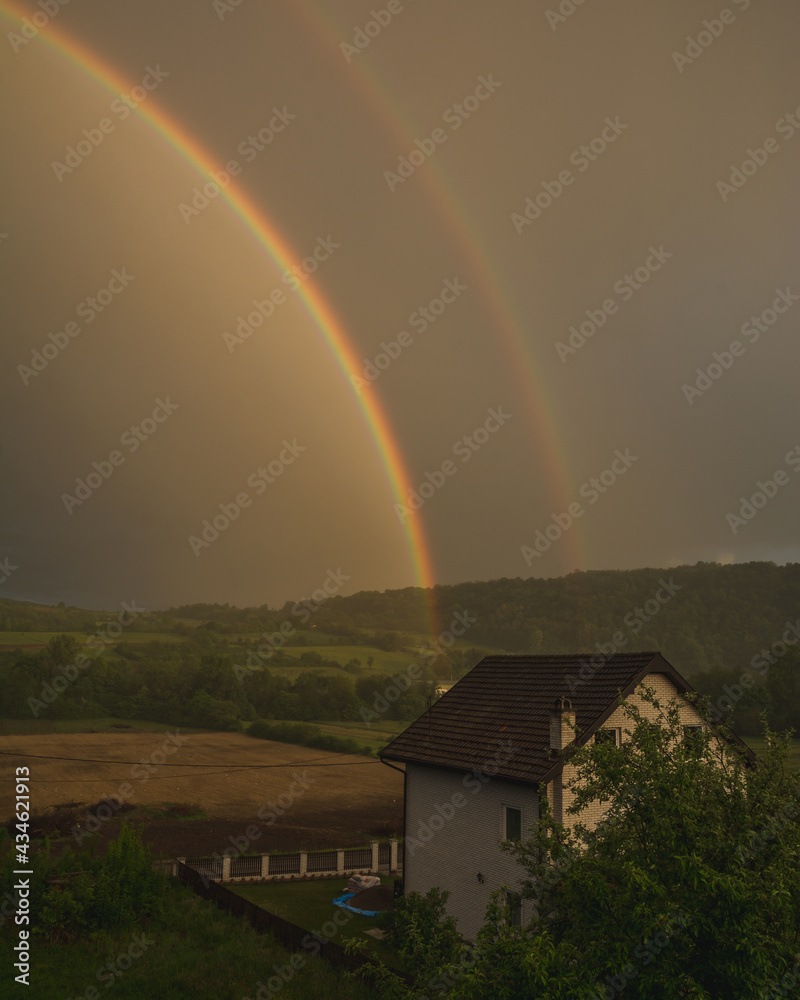Rainbow in the sky over the rural regia in the western Serbia