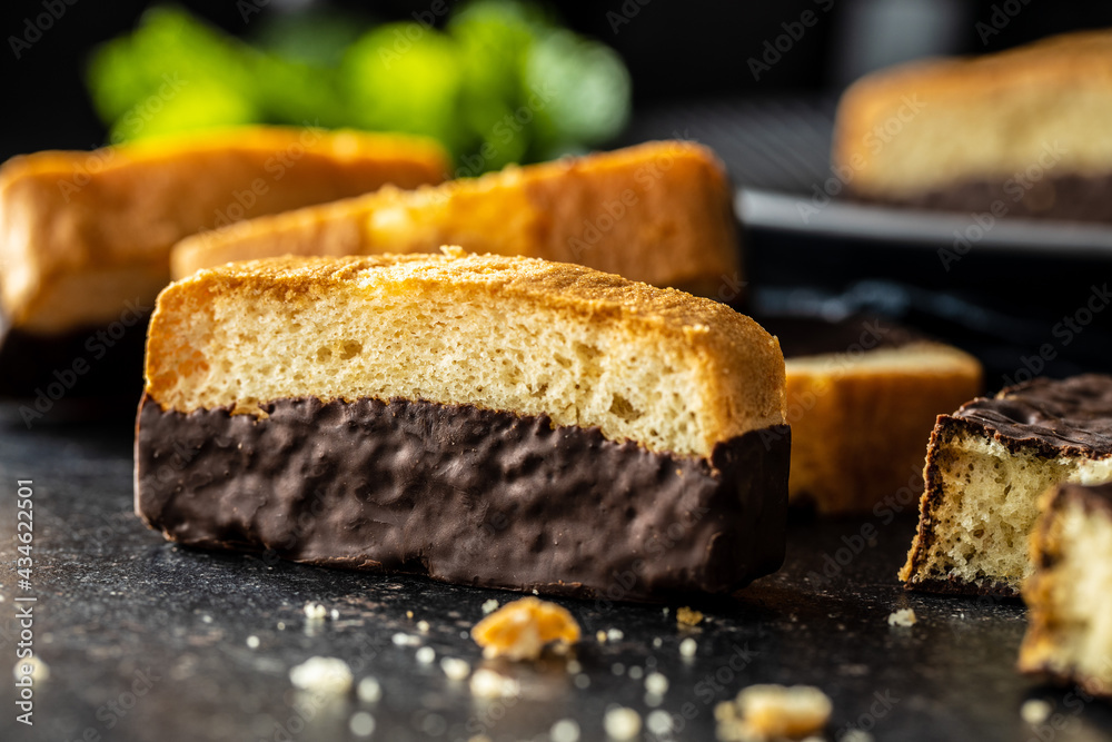 Sliced sponge dessert. Sweet sponge cake with chocolate