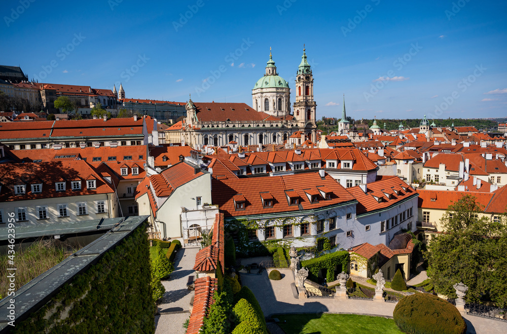 Obraz premium View from Vrtbovska garden to red roof of Prague Lesser town, St. Nicholas curch and complex of Prague castle