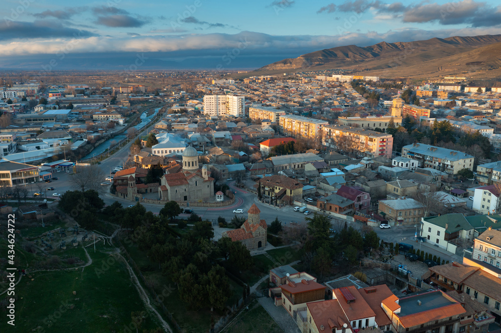 Scenic aerial view of old town of georgian city of Gori at spring