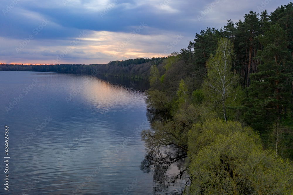 Lake Selyava, morning sunrise. Forest and lake.