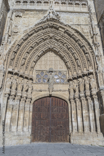 Vertical shot of the Cathedral of San Antolin under the sunlight in Palencia, Spain photo