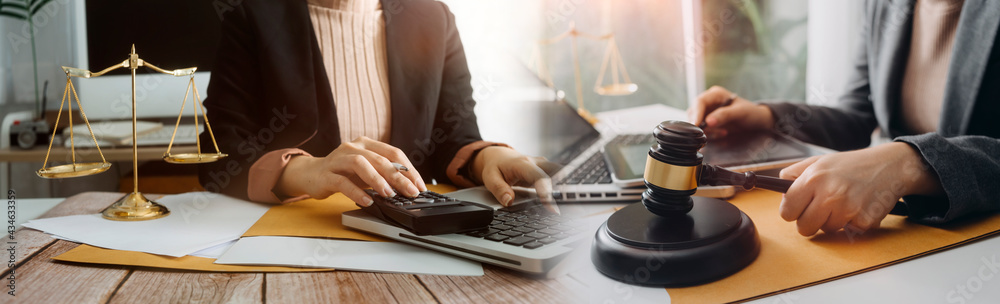 justice and law concept.Male judge in a courtroom on wooden table and Counselor or Male lawyer working in office. Legal law, advice and justice concept. justice and law concept.Male judge in a courtroom on wooden table and Counselor or Male lawyer working in office. Legal law, advice and justice concept.