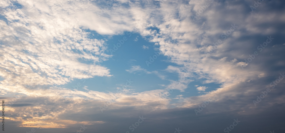 Colorful sunset and sunrise with clouds.Blue and orange color of nature.Many white clouds in the blue sky.The weather is clear today.sunset in the clouds.The sky is twilight. Colorful sunset and sunrise with clouds.Blue and orange color of nature.Many white clouds in the blue sky.The weather is clear today.sunset in the clouds.The sky is twilight.