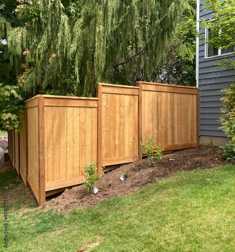 Fencing in a staggered row on a hill, new, cedar