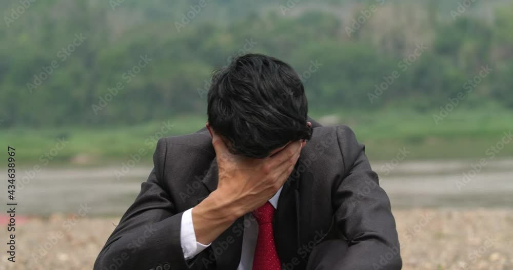 Asian Businessman Depressed
Asian Businessman Depressed