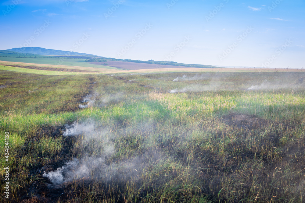 Fires in the steppe, the grass is burning in the fields. Fires in the steppe, the grass is burning in the fields.