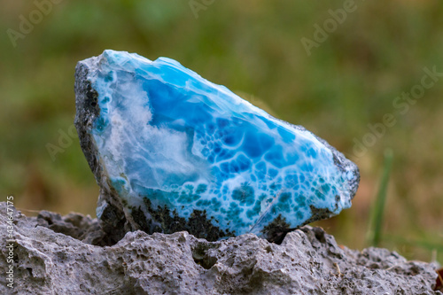 blue Larimar Gemstone on a rock