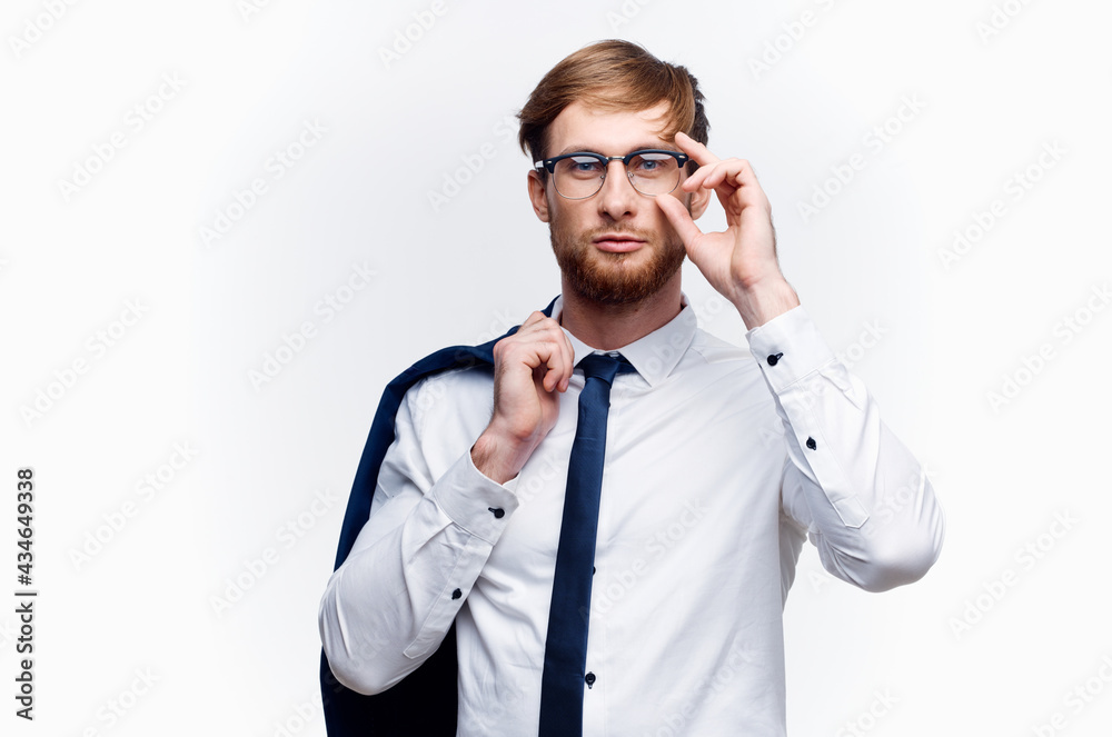 business man with a jacket over his shoulders wearing glasses self-confidence official business man with a jacket over his shoulders wearing glasses self-confidence official