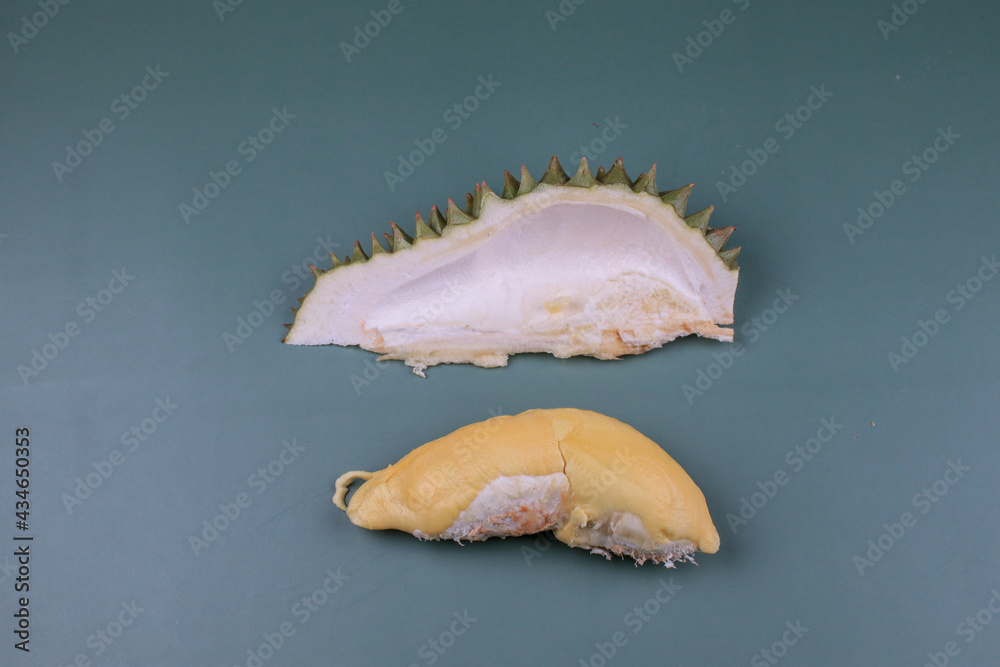 Durian. Durian peel with yellow color on green pastel background. King of fruit from Thailand on summer season Durian. Durian peel with yellow color on green pastel background. King of fruit from Thailand on summer season