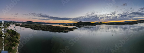 Sunrise aerial 180 degree panorama waterscape with clouds