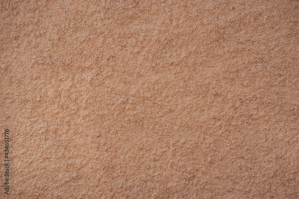 Fototapeta premium Rugged concrete texture. Apricot color. Background for designs