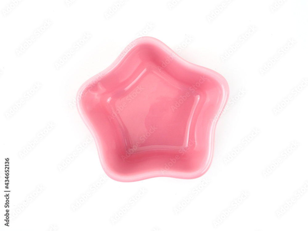 Top view, Empty pink star-shape ceramic plate isolated on a white background. Use for home or restaurant, food design. Kitchen accessory.. Top view, Empty pink star-shape ceramic plate isolated on a white background. Use for home or restaurant, food design. Kitchen accessory..