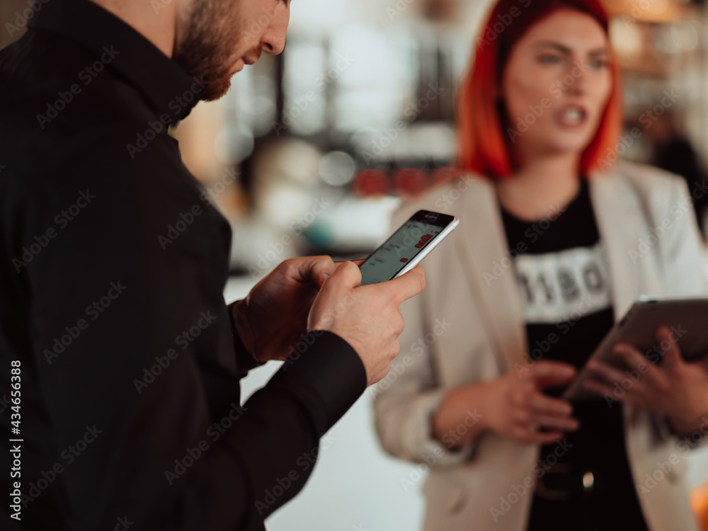 macro photo of young people using the phone during a break from work.free space macro photo of young people using the phone during a break from work.free space
