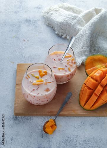 Photography Two cups of creamy mango sago dessert from Hongkong