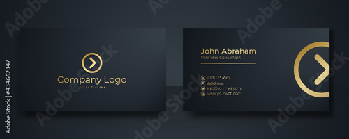 Modern Business Card - Creative and Clean Business Card Template. Luxury business card design template. Elegant dark back background with abstract golden wavy lines shiny. Vector illustration