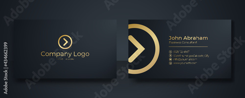 Modern Business Card - Creative and Clean Business Card Template. Luxury business card design template. Elegant dark back background with abstract golden wavy lines shiny. Vector illustration