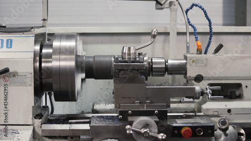 Metalworking milling machine. Produces metal detail in a factory. Machine tools for metal working. A metal workpiece is machined by an electric machine. Cutting metal modern processing technology