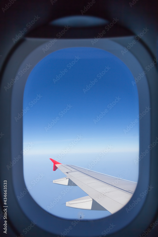 view from the window of airplane with blue sky view from the window of airplane with blue sky