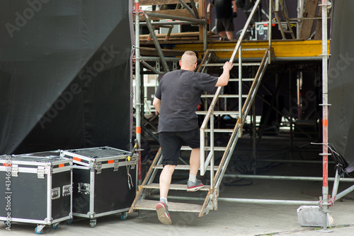 A man walks behind the scenes of the mobile stage