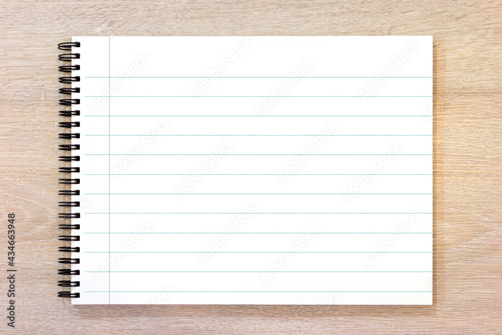 Blank notepad on wood background Blank notepad on wood background