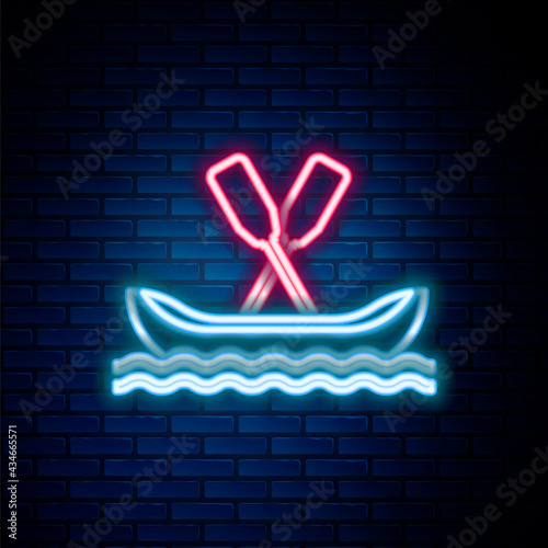 Glowing neon line Rafting boat icon isolated on brick wall background. Kayak with paddles. Water sports, extreme sports, holiday, vacation, team building. Colorful outline concept. Vector