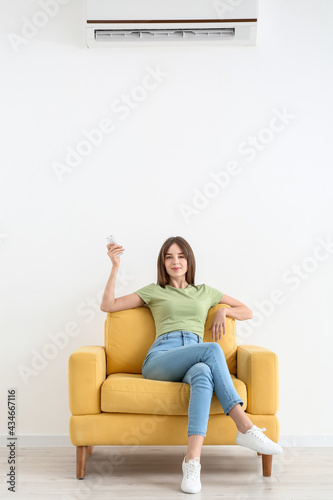 Young woman with air condit...