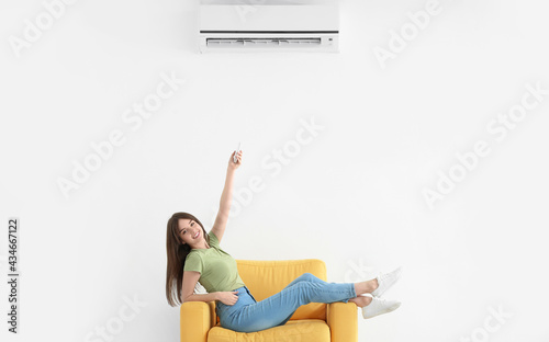 Young woman with air condit...