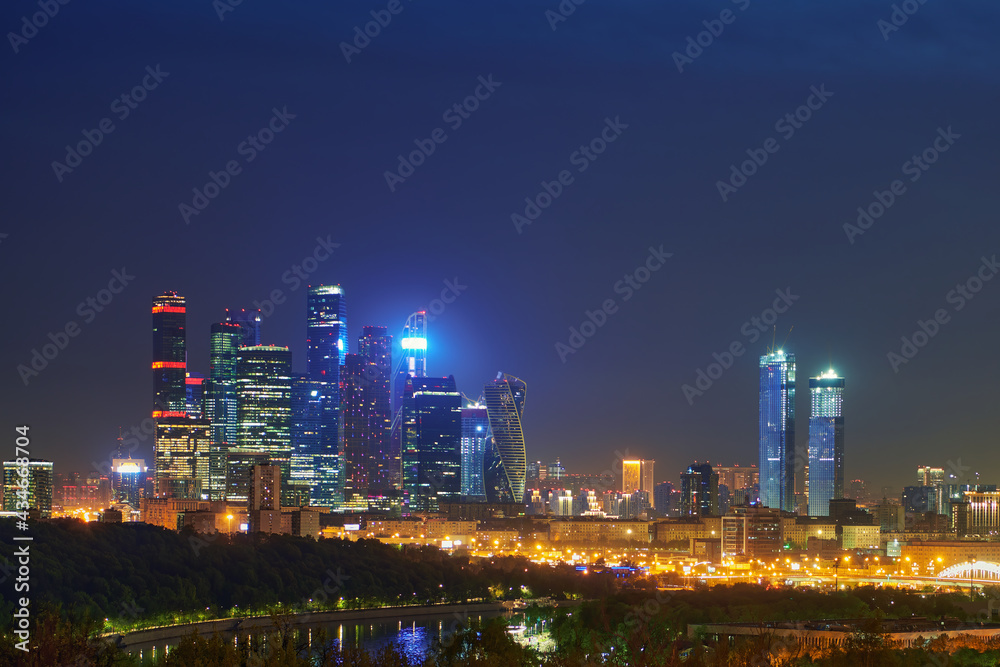 Night urban landscape panorama of Moscow with Moscow-city downtown business center with tall buildings. Cityscape of illuminated city. Moscow. Russia.