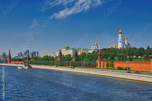 View of the Moscow Kremlin from the Moscow river. Red brick towers and Bell Tower Of Ivan The Great. Grand Kremlin palace. Travel to the capital of Russia. Moscow, Russia.