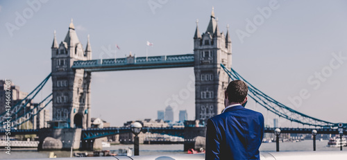 Photography British businessman talking on mobile phone outdoor in London city, UK