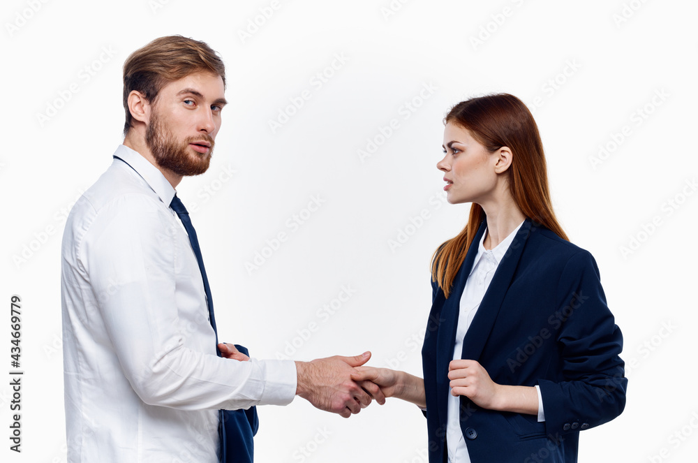 work colleagues shake hands communication contract light background