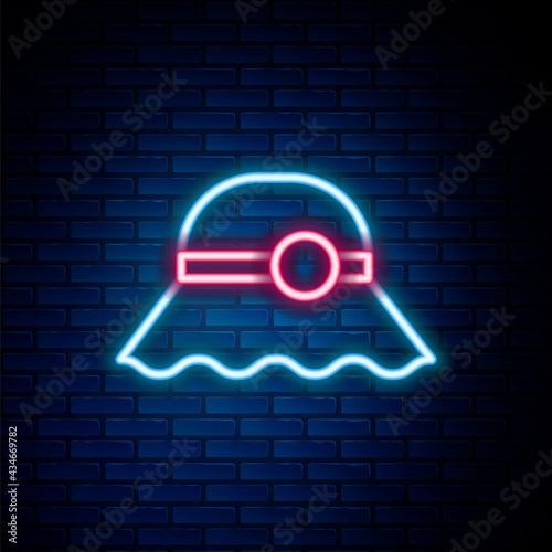 Glowing neon line Elegant women hat icon isolated on brick wall background. Colorful outline concept. Vector