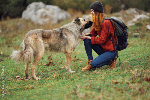 woman hiker backpack travel friendship walking the dog fun mountains © SHOTPRIME STUDIO