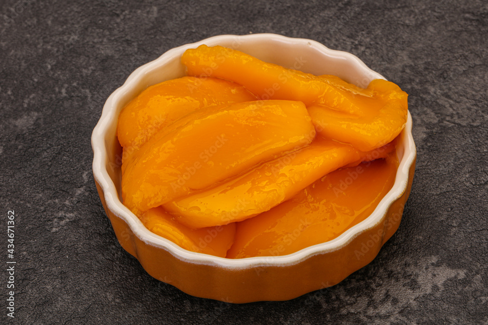 Sweet mango slices in syrop Sweet mango slices in syrop