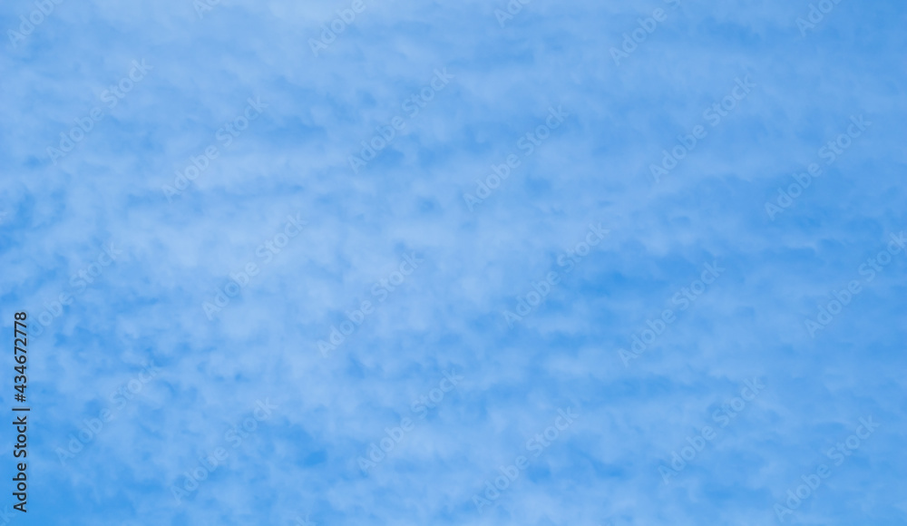 Background of blue sky with white clouds