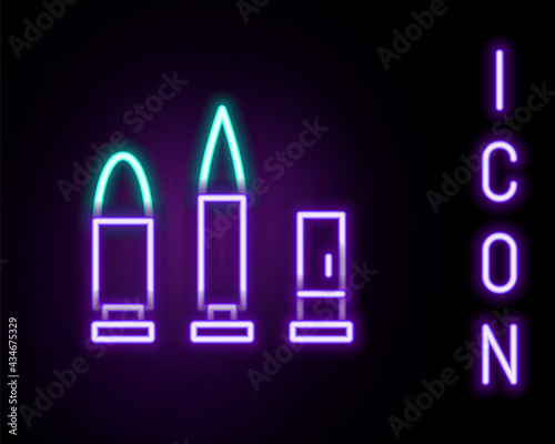 Glowing neon line Bullet and cartridge icon isolated on black background. Colorful outline concept. Vector