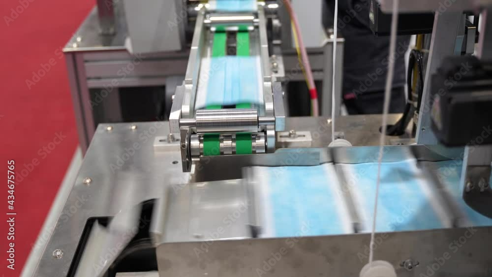 automatic machine for the manufacture of medical masks with nanofiber. Coronavirus and Covid-19 Protection automatic machine for the manufacture of medical masks with nanofiber. Coronavirus and Covid-19 Protection
