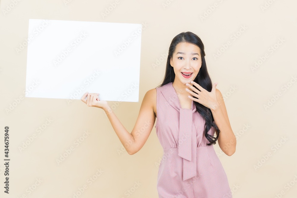 Portrait beautiful young asian woman with empty white billboard Portrait beautiful young asian woman with empty white billboard