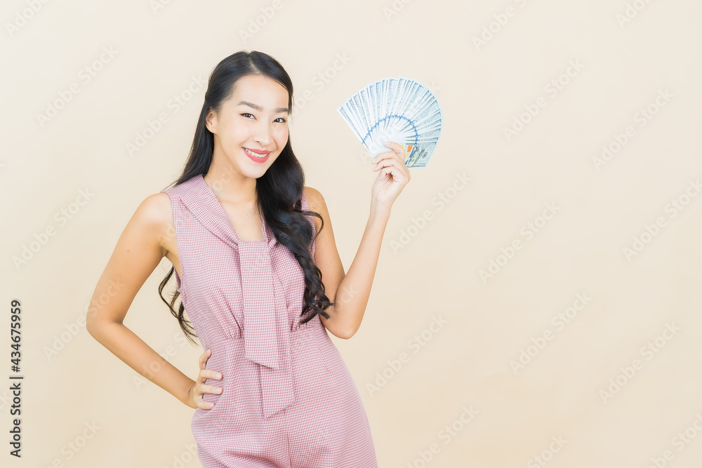Portrait beautiful young asian woman smile with a lot of cash and money Portrait beautiful young asian woman smile with a lot of cash and money